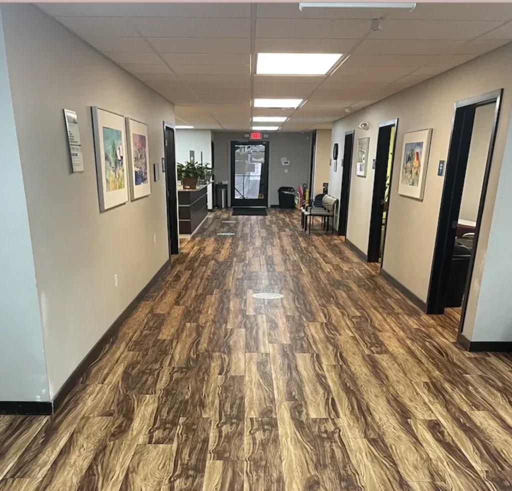 Hallway and examination-room entrances at Adrian Urgent Care