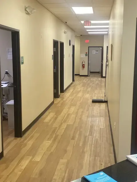 Hallway and examination-room entrances at Southgate Urgent Care